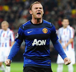 Manchester United's Wayne Rooney celebrates scoring from the penalty spot during their champions league match against Otelul Galati