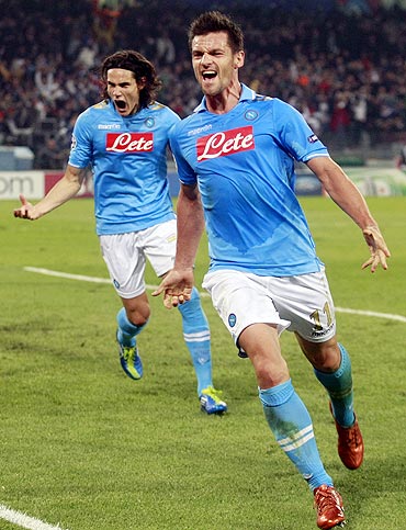 Napoli's Christian Maggio (right) celebrates with teammate Edinson Cavani after scoring against Bayern Munich