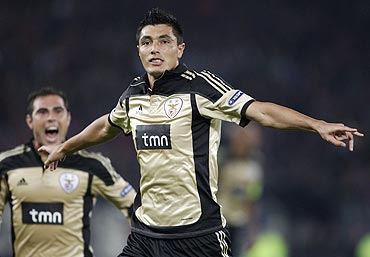 Benfica's Bruno Oscar Cardozo (right) celebrates after scoring against FC Basel