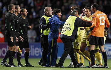 Villarreal players argue with match officials and stewards after their match against Manchester City