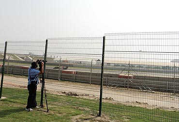 A Red Bull goes uphill towards Turn 3, as seen from the Picnic Stands, North