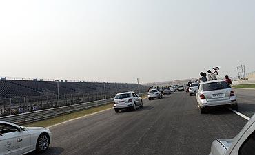 An assortment of Mercs ride downhill towards Turn 5