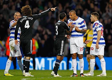 Ashley Cole of Chelsea argues with Anton Ferdinand of Queens Park Rangers (right) during their EPL match on Sunday