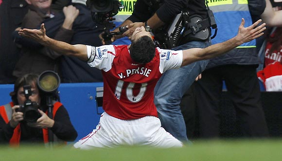 Van Persie celebrates after scoring his third goal