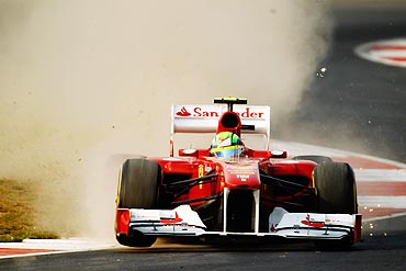 Felipe Massa of Brazil and Ferrari rides over the kerbs during the Indian Formula One Grand Prix