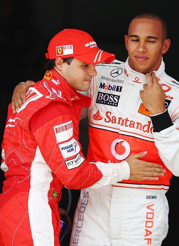Felipe Massa (left) of Brazil and Ferrari celebrates in parc ferme with Lewis Hamilton