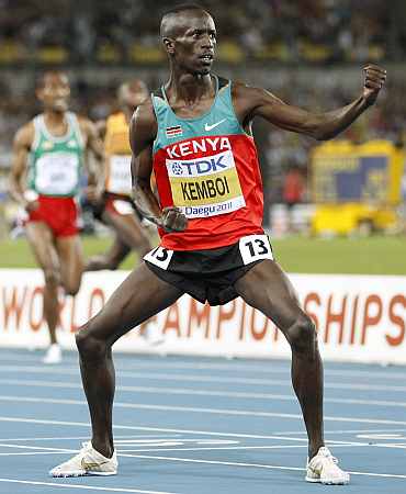Ezekiel Kemboi celebrates after winning the 3,000 metres steeplechase