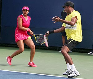 Mahesh Bhupathi and Sania Mirza in action against Lucie Hradecka and Frantisek Cermak during their mixed doubles match on Thursday
