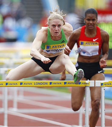 Sally Pearson clears a hurdle during her women's 100 metres hurdles heats