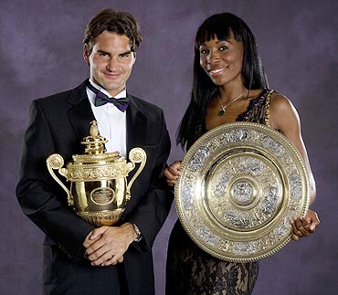 Roger Federer and Venus Williams pose with their trophies at the 2007 Wimbledon ball