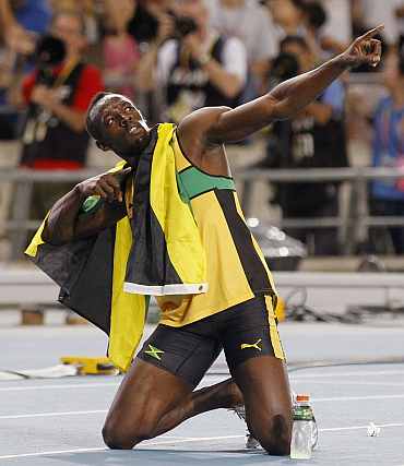 Usain Bolt celebrates claiming gold in the men's 200 metres final