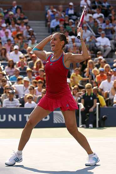 Flavia Pennetta of Italy celebrates after defeating Maria Sharapova of Russia during the U.S. Open