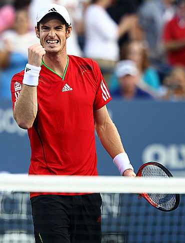 Andy Murray reacts after winning the match against Robin Haase
