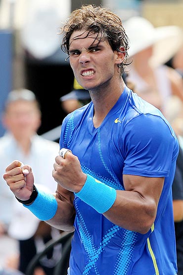 Rafael Nadal celebrates after defeating David Nalbandian