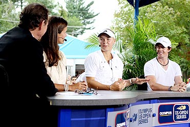 Caroline Wozniacki and Rory McIlroy appear on the EPSN Game Day desk with Cliff Drysdale and Mary Joe Fernandez