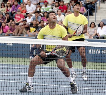 Paes and Bhupathi in action against Somdev and Conrad