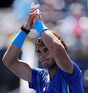 Rafael Nadal celebrates after defeating Gilles Muller