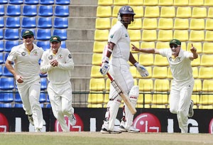 Watson, Clarke and Hussey celebrate the dismissal of Sangakkara