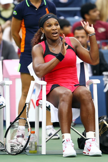Serena Williams of the United States argues with chair umpire Eva Asderakia (not pictured) during a break in play against Samantha Stosur of Australia