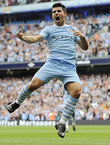 Manchester City's Sergio Aguero celebrates after scoring against Wigan Athletic