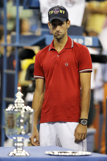 Novak Djokovic of Serbia looks on during the trophy ceremony