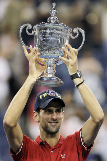 Novak Djokovic of Serbia celebrates with the trophy after he defeated Rafael Nadal of Spain during the Men's Final on Day Fifteen of the 2011 US Open