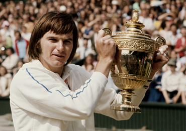 Jimmy Connors of the United States holds aloft the trophy after defeating Ken Rosewall, 61, 61, 64in their Men's Singles final match at the Wimbledon Lawn Tennis Championship on 6th July 1974