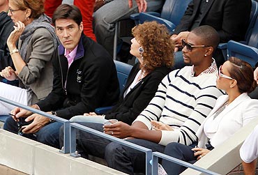 Actor Thomas Gibson (left), NBA star Chris Bosh (2nd from right) and his wife Adrienne (right) at the US Open woman's final