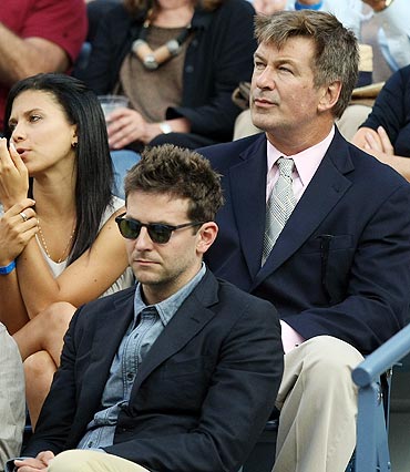 Actors Alec Baldwin (top right), Bradley Cooper (bottom right) and Ron Rifkin watch the US Open men's final between Rafael Nadal and Novak Djokovic