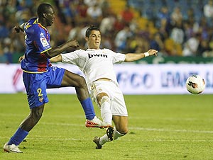 Real Madrid's Cristiano Ronaldo (right) and Levante's Arouna Kone vie for possession