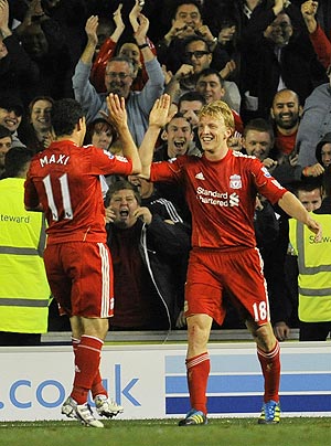 Liverpool's Dirk Kuyt (right) celebrates with team-mate Maxi Rodriguez after netting against Brighton and Hove Albion during their League Cup match on Wednesday