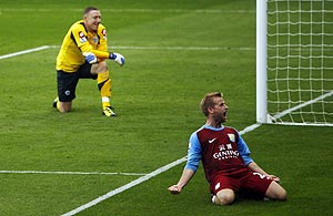 Aston Villa's Barry Bannan (right) celebrates scoring from the penalty spot past Queens Park Rangers goalkeeper Paddy Kenny during their English Premier League match at Loftus Road in London on Sunday