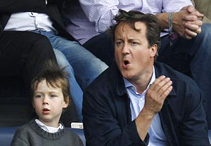 Britain's Prime Minister David Cameron and son Arthur at the EPL match at the EPL match between Queens Park Rangers and Aston Villa on Sunday