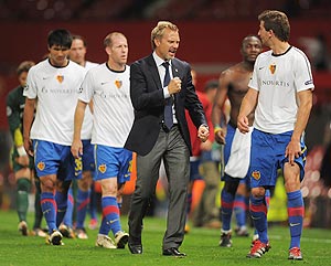 Thorsten Fink manager of FC Basel celebrates with player David Abraham after their  Champions League match against Manchester United on Tuesday