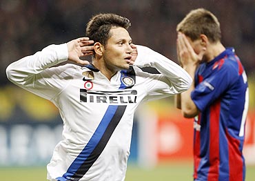 Inter Milan's Mauro Zarate (left) celebrates after scoring as CSKA Moscow's Pavel Mamaev looks on dejected