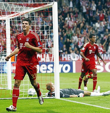 Bayern Munich's Mario Gomez (left) celebrates after scoring against Manchester City