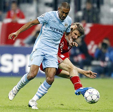 Bayern Munich's Thomas Mueller (right) challenges Manchester City's Gael Clichy