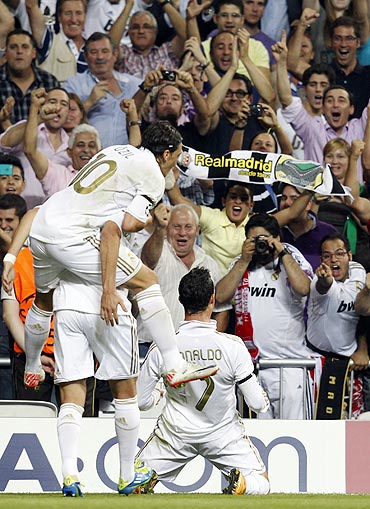 Real Madrid's Cristiano Ronaldo celebrates his goal against Ajax Amsterdam in front of the crowd