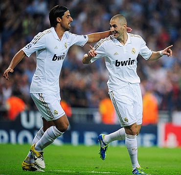 Real Madrid's Karim Benzema (right) celebrates with Sami Khedira after scoring against Ajax