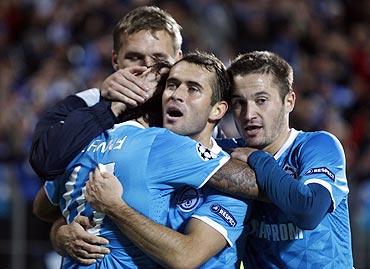 Zenit St. Petersburg's players congratulate teammate Danny (left, foreground) after scoring against Porto