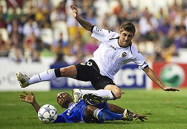 Valencia's Pablo Hernandez (right) is challenged by Chelsea's Florent Malouda
