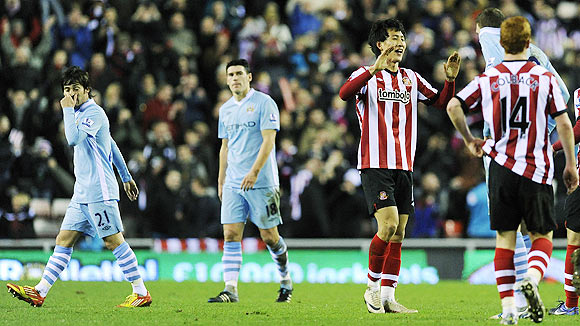 Sunderland's Ji Dong-won (centre) reacts after their English Premier League soccer match against Manchester City in Sunderland