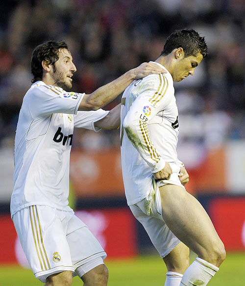 Real Madrid's Cristiano Ronaldo (right) celebrates a goal against Osasuna with teammate