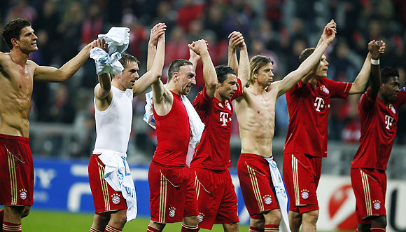 Players of Bayern Munich celebrate after their Champions League quarter-final second leg soccer match against Olympique Marseille in Munich