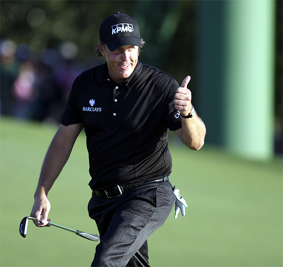 Phil Mickelson walks onto the 18th green as he wins the 2010 Masters on April 11, 2010