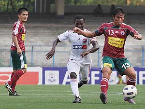 Surkumar (right) of Mohun Bagan goes past Lajong player as Sunil Chettri looks on