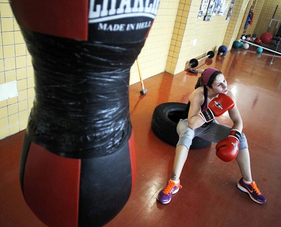 Spanish boxer Marta Branas takes a moment to rest during a training session