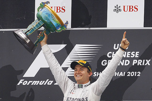 Mercedes Formula One driver Nico Rosberg of Germany celebrates on the podium