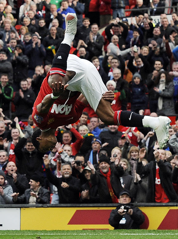 Manchester United's Nani does a somersault in celebration after scoring against Aston Villa during their Premier League match on Sunday