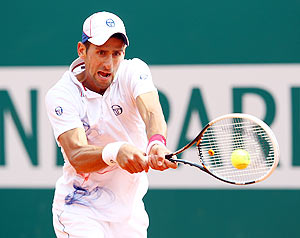 Serbia's Novak Djokovic plays a backhand against Italy's Andreas Seppi during the Monte Carlo Masters on Wednesday